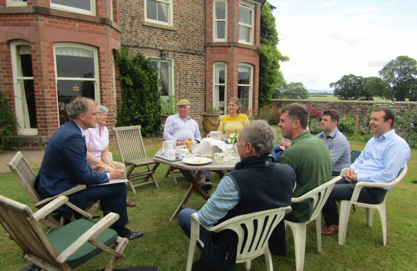 Julian meeting a group of farmers