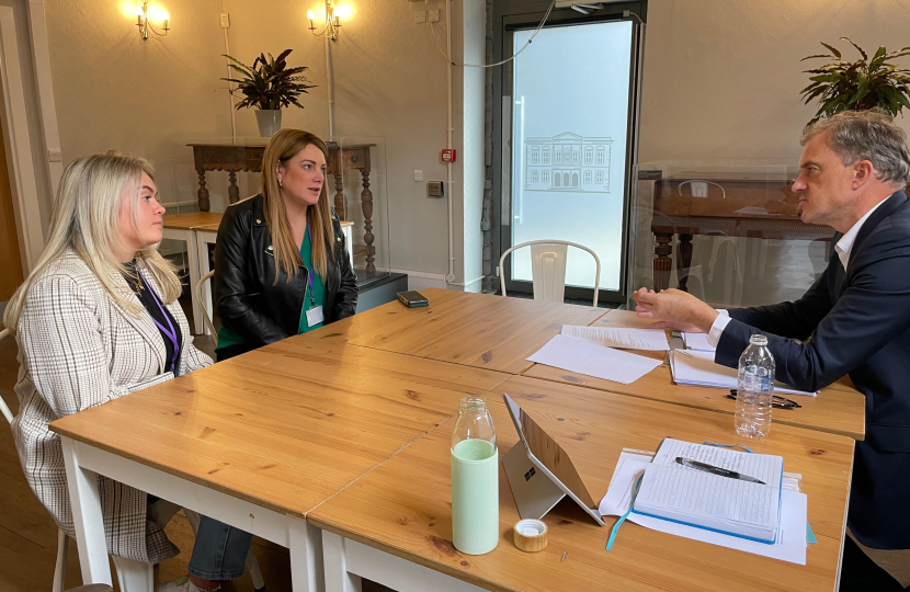 Julian Smith MP speaking with Tia-Joanne Fenton (left) and Kat Hawley (centre)