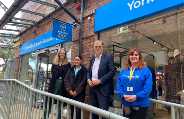 Julian Smith MP with Mary, Yorkshire Cancer Research’s Retail Area Manager (right) and Yorkshire Cancer Research data analysis team. 