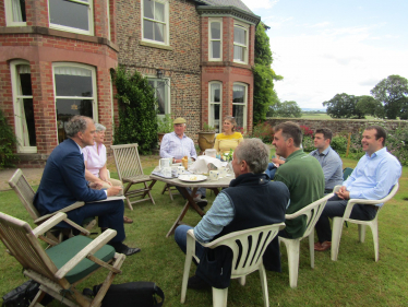 Julian meeting a group of farmers