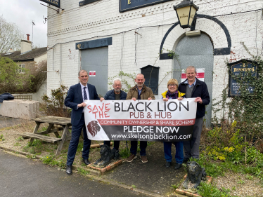 Julian and members of the team outside the pub